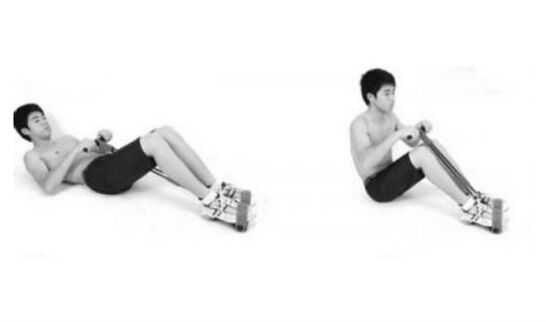 On the expiration, he simultaneously lifts the upper part of the body and folds his legs on his knees